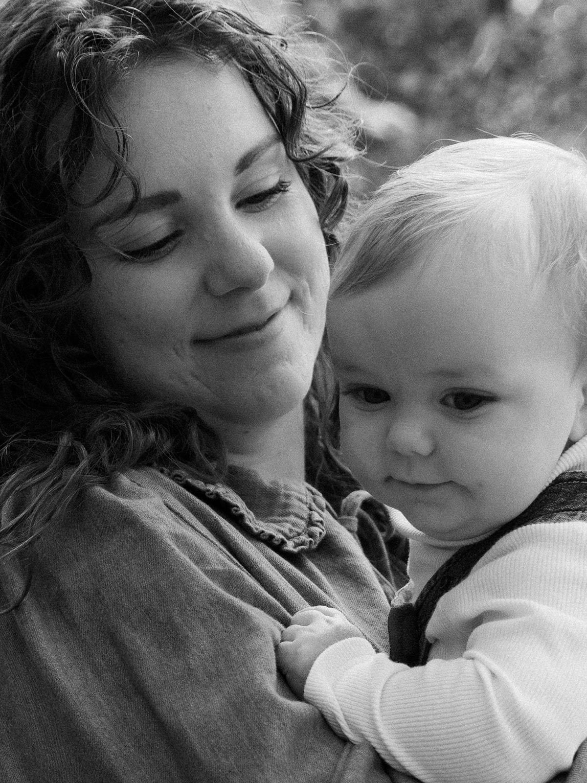 Black and white portrait of a mother holding her baby